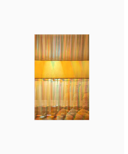 Diffraction grating photograph taken from a couch interior in a Louisiana home, rendered with rainbow spectral light effects.