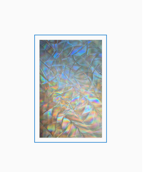 Diffraction grating photograph showing pearlescent rainbow patterns through a textured window film.