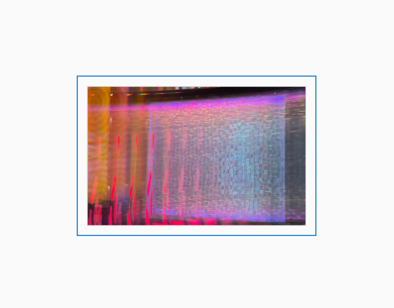 Diffraction grating photograph of a decorative casino wall at the Atlantis Resort in Reno, Nevada, rendered with rainbow spectral light.