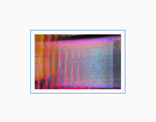 Diffraction grating photograph of a decorative casino wall at the Atlantis Resort in Reno, Nevada, rendered with rainbow spectral light.