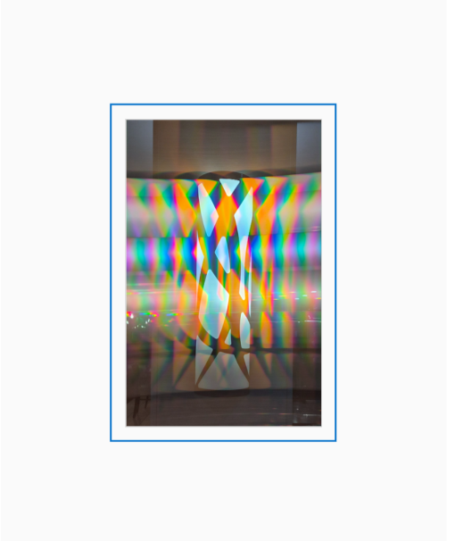 Diffraction grating photograph of an ornate hotel lobby light fixture in Springfield, Ohio, rendered with rainbow spectral color.